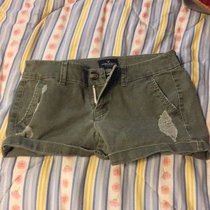 Ripped green shorts